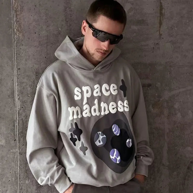 SUDADERA CON CAPUCHA DE LOCURA ESPACIAL DE PLANETA ROTO